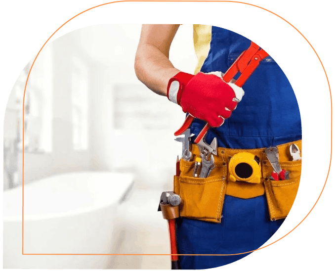 A person holding tools in their hands while wearing an apron.